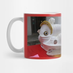 Unfinished white plastered Chinese Dragon mask on a festival Mug